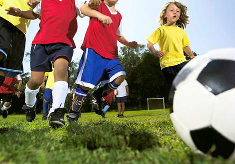 Children playing soccer.