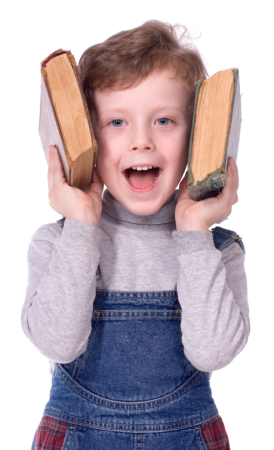 The boy with books smiles